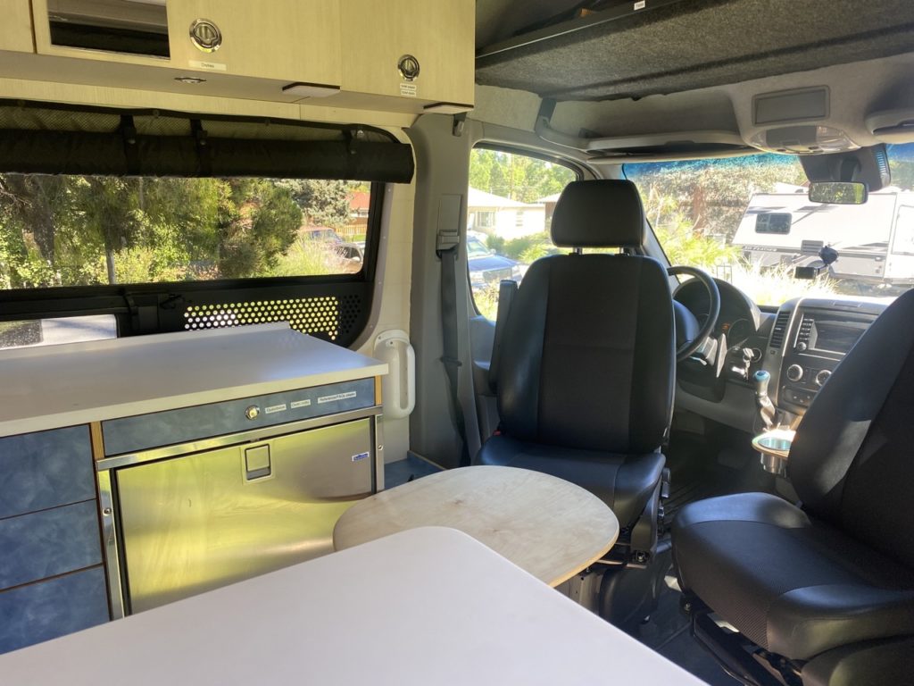 Both front seats swivel and a removable table creates space for dining or work.